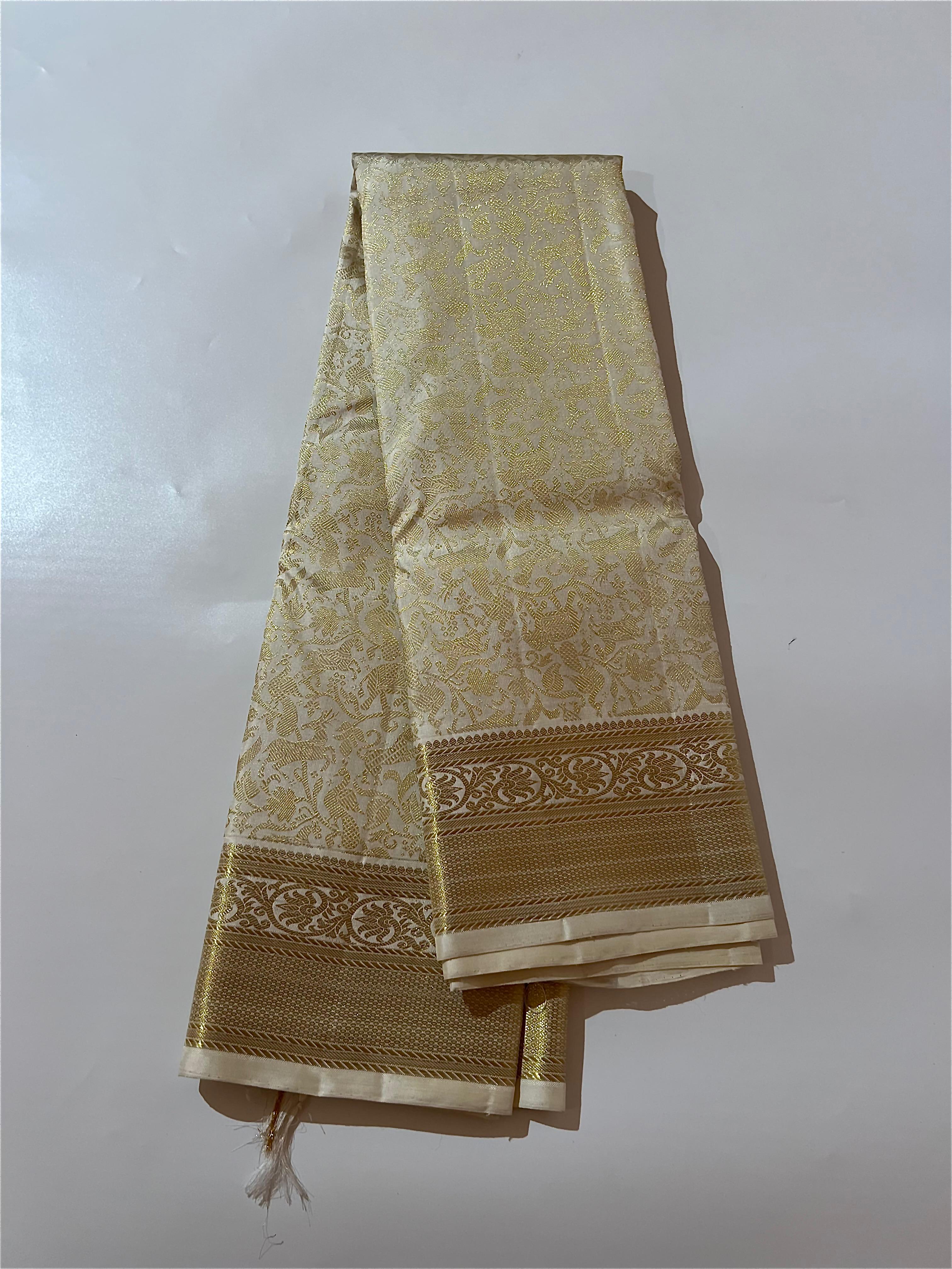 White and golden Kanjeevaram silk saree